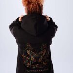 A hoodie with butterfly embroidery on the back.